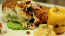 Amritsar spiced halibut with mustard mushy peas, caper kachumbar and tandoori potato wedges -