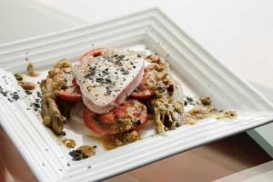 Grilled bonito tuna over escalivada and olive vinaigrette and castillo de canena picual oil -