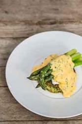 Organic asparagus with pea pancakes, herb sabayon and poached eggs by Tom Aikens -