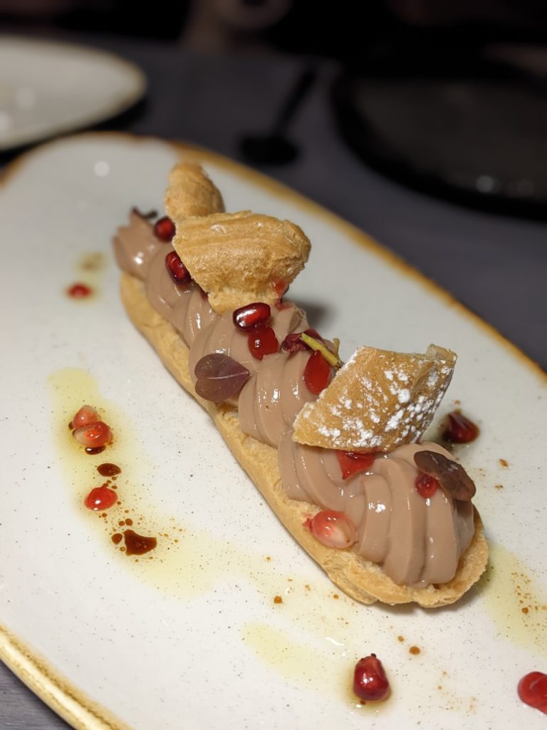 https://www.foodepedia.co.uk/wp-content/uploads/2022/11/pomegranite-eclair-lusin-768x1024.jpg